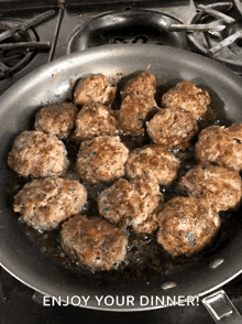 meatballs are being cooked in a frying pan with the words enjoy your dinner above them