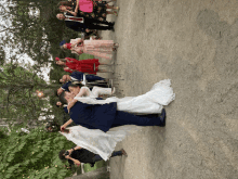 the bride and groom are kissing in front of their wedding guests