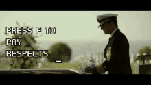 a man in a military uniform is standing in front of a cemetery with the words press f to pay respects