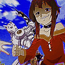 a girl in a red shirt is holding a robot in her hands .
