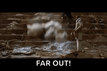 a man is standing in front of a staircase with smoke coming out of it and the words `` far out '' written on the screen