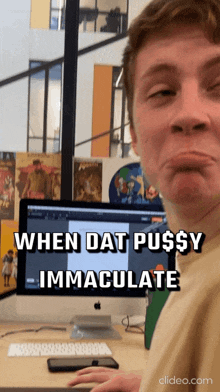 a man sitting in front of an apple computer with the words when dat pussy immaculate on the screen