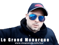 a man wearing sunglasses and a hat that says le grand monarque on it