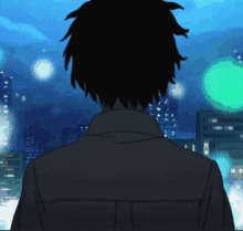 a silhouette of a person looking out over a city