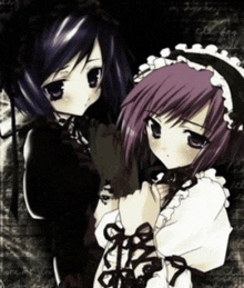 a girl with purple hair and a girl with black hair are standing next to each other