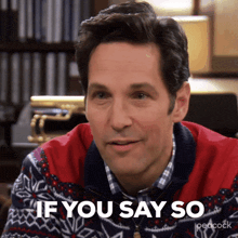 a man is wearing a peacock sweater and says if you say so