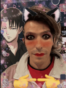 a man wearing a cat ear headband is standing in front of a picture of levi