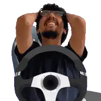 a man wearing glasses is holding his head while sitting in a steering wheel