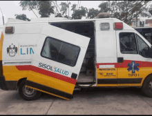 a sisol salud ambulance has its doors open