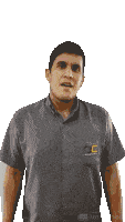 a man wearing a grey shirt with cc solutions written on the pocket
