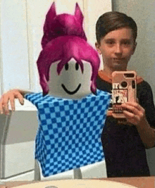 a boy is taking a selfie with a roblox character in a blue and white checkered shirt .