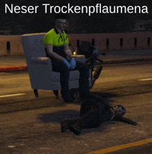 a man sitting in a chair next to a man laying on the ground with the words neser trockenpflaumena written above him