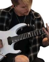 a man in a plaid shirt plays a white electric guitar