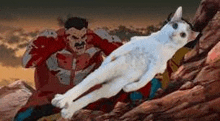 a white cat is laying on top of a rock next to a superhero .