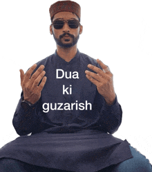 a man wearing sunglasses and a black shirt with the words dua ki guzarish on it