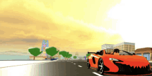 an orange car is driving down a road in a video game