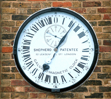 a clock on a brick wall says shepherd patentee 53 leaden st london