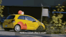 a yellow car is driving down a road and says heille le malade