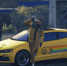 a man drinking from a bottle next to a yellow car