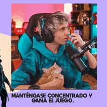 a man wearing headphones is holding a cat and says mantengase concentratado y gana el juego