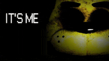 a close up of a yellow bear 's face with the words `` it 's me '' written on it .