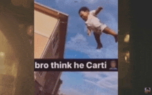 a child is flying through the air in front of a building with the words `` bro think he carti '' written on the bottom .