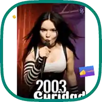 a woman singing into a microphone with the year 2003 cuidad