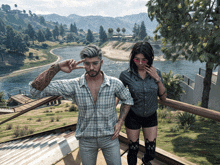 a man and a woman are standing on a balcony overlooking a river