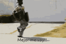 a man carrying a skateboard says " mejor me voy " in spanish