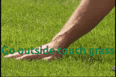 a person 's hand is on the grass with the words go outside touch grass written above it