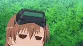 a cartoon character wearing a goggles with a green screen on top of her head