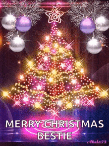 a merry christmas bestie card with a christmas tree and decorations