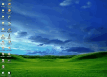 a computer screen with a grassy field and a blue sky