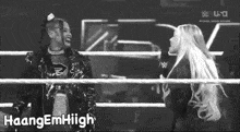 a black and white photo of two women in a wrestling ring with haangemhigh written on the bottom