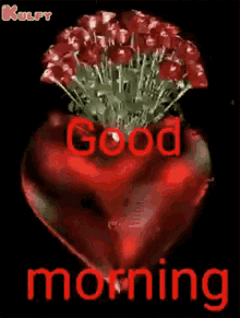 a heart shaped vase filled with red roses and the words `` good morning ''