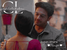 a man and a woman are hugging and the words pyaar bharat pause are on the bottom