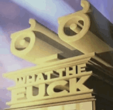 a sign that says " what the fuck " on top of a building