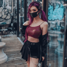 a woman with purple hair wears a black mask