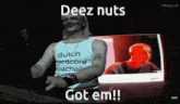 a man wearing a dutch hardcore shirt is standing in front of a laptop and says deez nuts got em !!