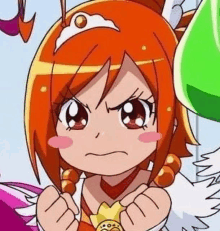 a close up of a cartoon girl with orange hair and a tiara making a funny face .