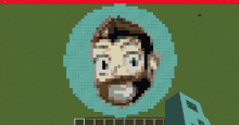 a pixel art of a man 's face is displayed on a computer screen