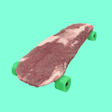 a piece of raw meat on a green skateboard