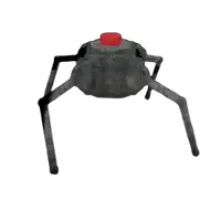 a black spider with a red button on top of it