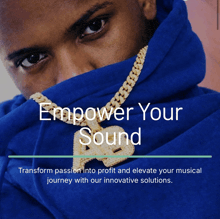 a man wearing a blue hoodie with the words empower your sound on it