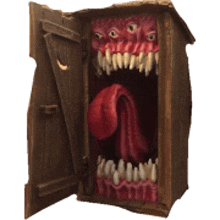 a wooden box with a monster in it 's mouth and teeth