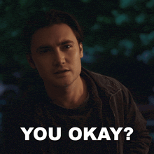 a man with a serious look on his face is next to the words you okay