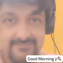 a man wearing headphones with the words good morning ji on the bottom right