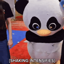 a stuffed panda mascot says shaking intensifies