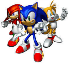 sonic the hedgehog , knuckles and tails are standing next to each other .