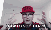 a man in a red hat and glasses is asking how to get there .